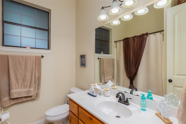 bathroom with toilet and vanity