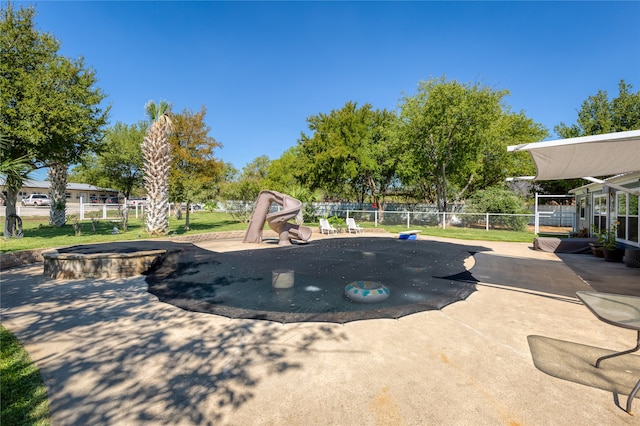 view of pool with a hot tub