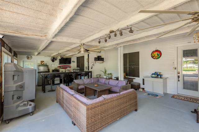 interior space featuring ceiling fan