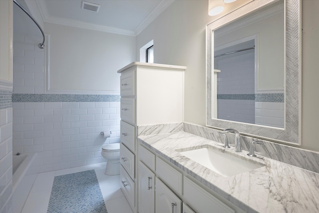 full bathroom featuring tile patterned flooring, crown molding, toilet, vanity, and tile walls