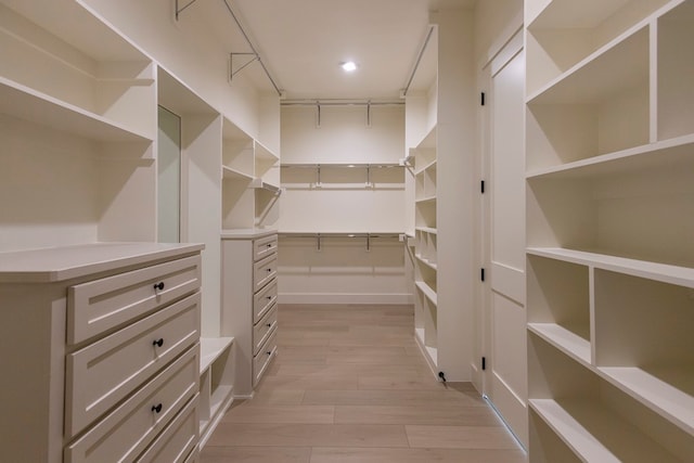 walk in closet featuring light hardwood / wood-style floors