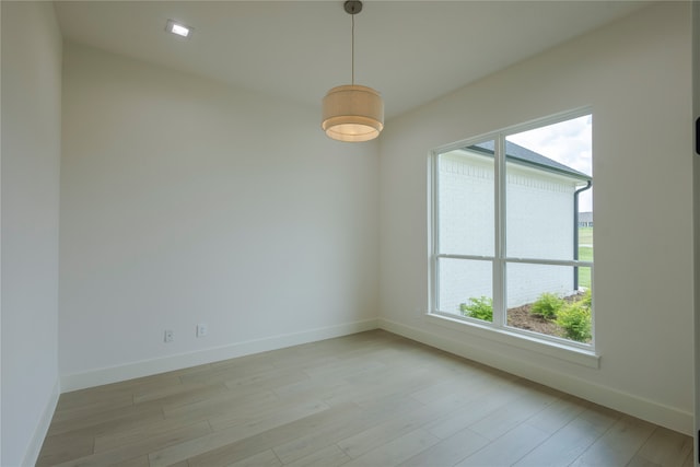 empty room with light hardwood / wood-style floors