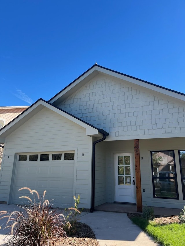 single story home with a garage