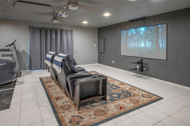 cinema featuring ceiling fan and light tile patterned floors