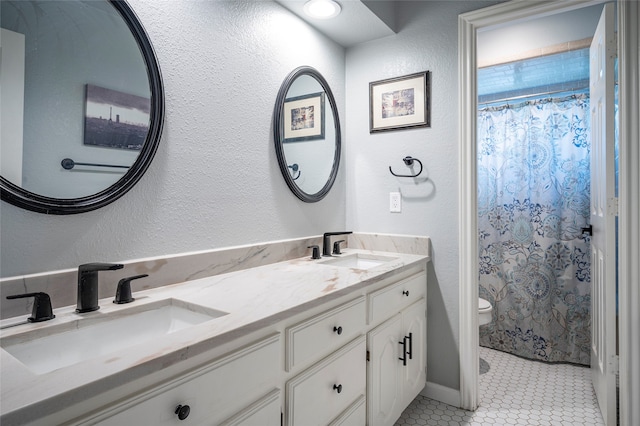 bathroom featuring a shower with curtain, tile patterned floors, toilet, and vanity