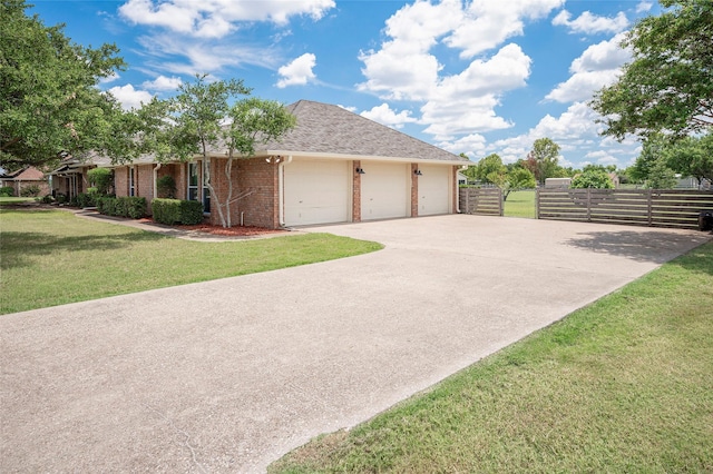 view of front facade with a garage and a front yard