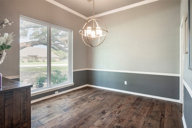 unfurnished dining area with an inviting chandelier, dark wood-type flooring, and ornamental molding