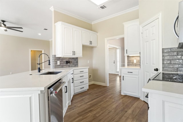 kitchen featuring appliances with stainless steel finishes, hardwood / wood-style floors, decorative backsplash, white cabinetry, and ceiling fan