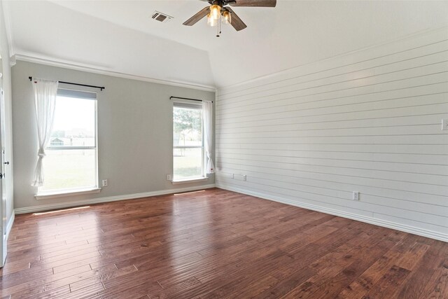 empty room with lofted ceiling, ceiling fan, and wood-type flooring