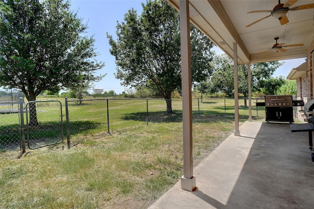 view of yard featuring a patio and ceiling fan