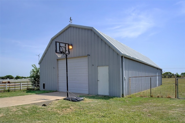 garage featuring a lawn