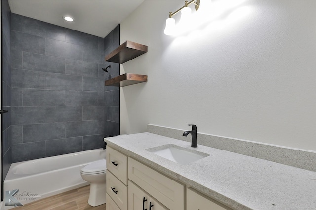 full bathroom featuring shower / bath combination, vanity, toilet, and wood finished floors