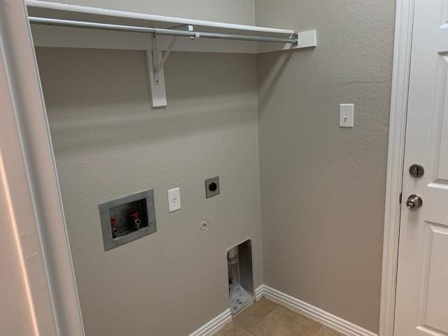 laundry room with hookup for a washing machine, hookup for a gas dryer, electric dryer hookup, and light tile patterned flooring