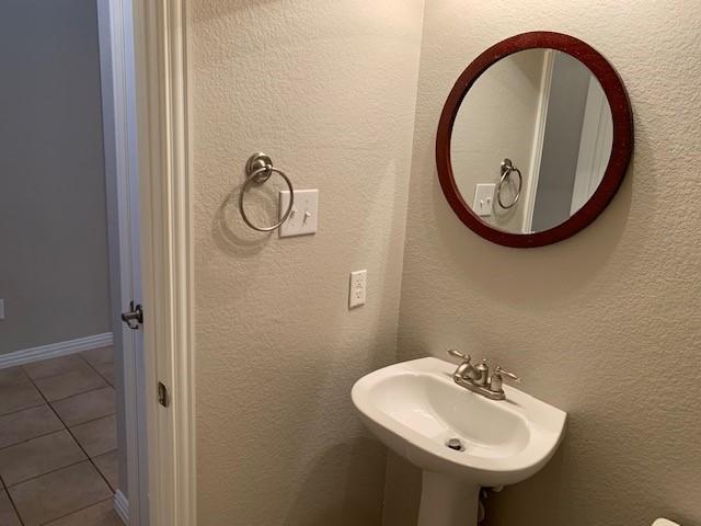 bathroom featuring sink and tile patterned flooring