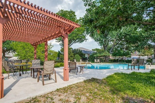 view of pool with a pergola and a patio