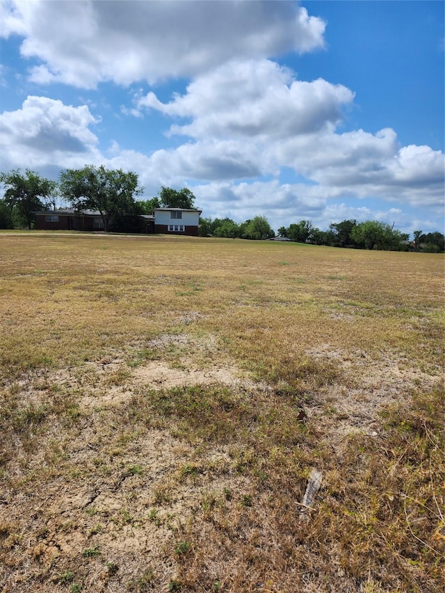 view of green lawn with a view of rural / pastoral area