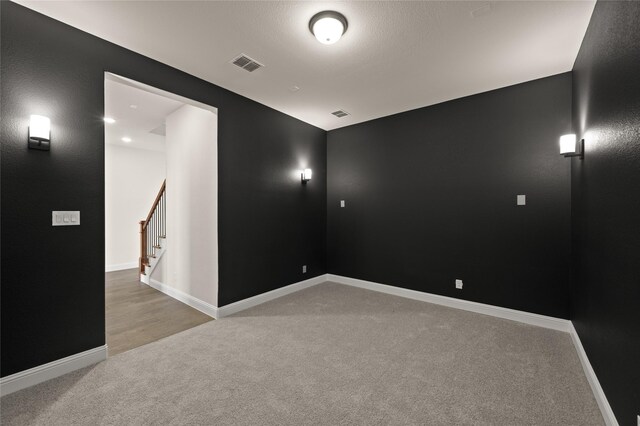 unfurnished dining area featuring dark hardwood / wood-style flooring and an inviting chandelier