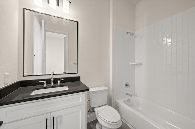 full bathroom with tiled shower / bath, vanity, and toilet