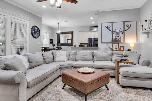 living area with ceiling fan, crown molding, and recessed lighting