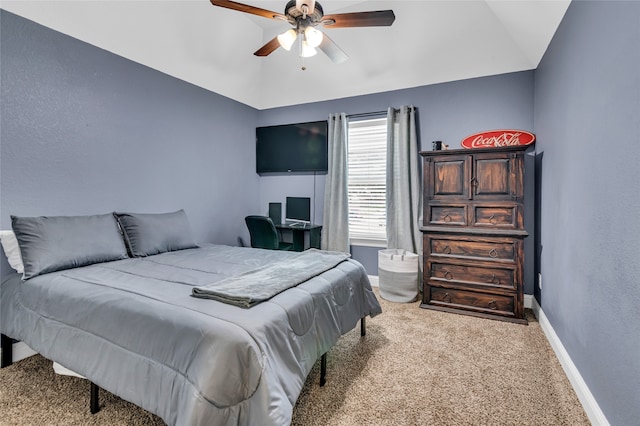 carpeted bedroom with lofted ceiling, ceiling fan, and baseboards