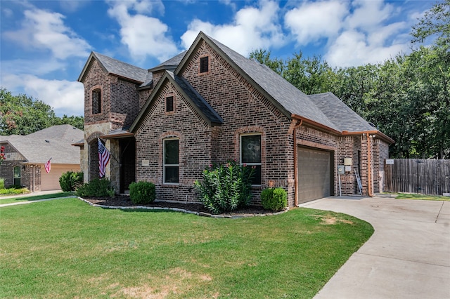 view of front of house with a garage and a front yard