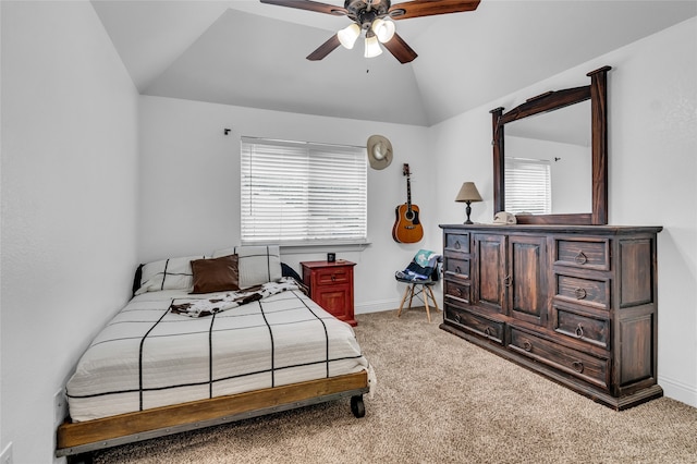 carpeted bedroom with lofted ceiling, ceiling fan, and baseboards