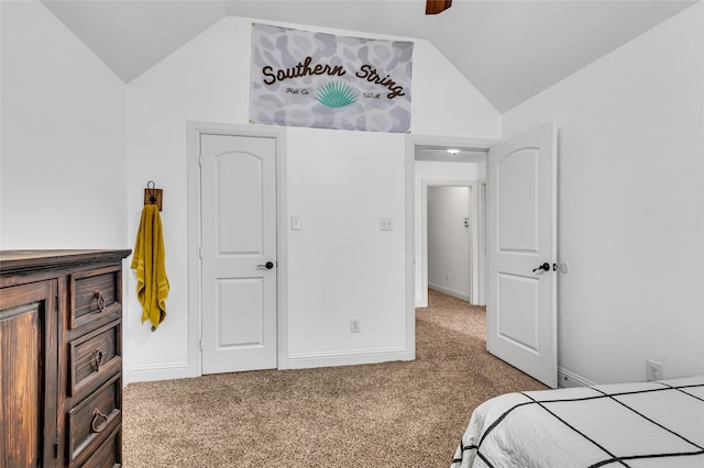 bedroom featuring vaulted ceiling, carpet flooring, a ceiling fan, and baseboards