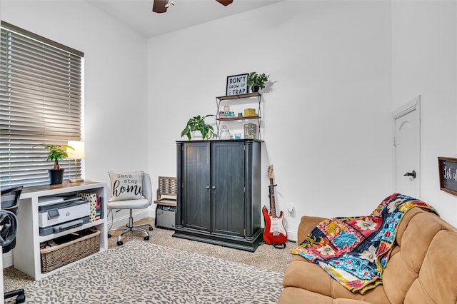 interior space featuring carpet floors, ceiling fan, and baseboards