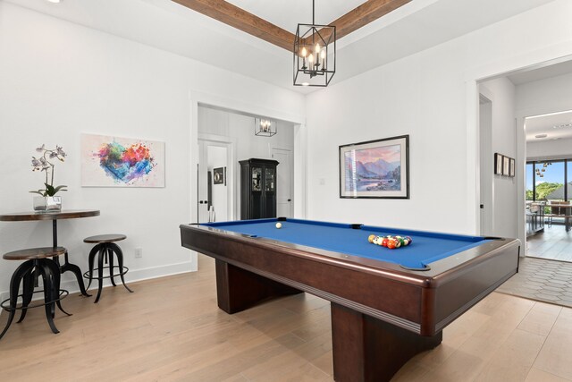 playroom with an inviting chandelier, pool table, and light hardwood / wood-style flooring