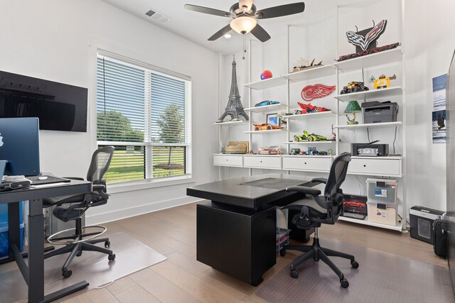 office area with ceiling fan and hardwood / wood-style floors