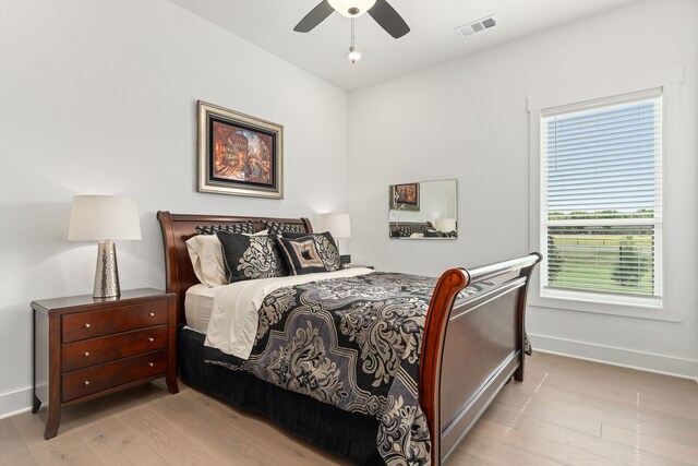 bedroom featuring ceiling fan and light hardwood / wood-style flooring