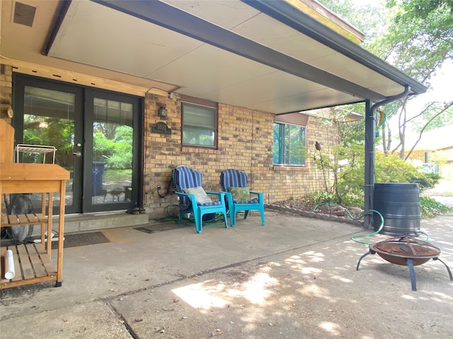 view of patio with a fire pit