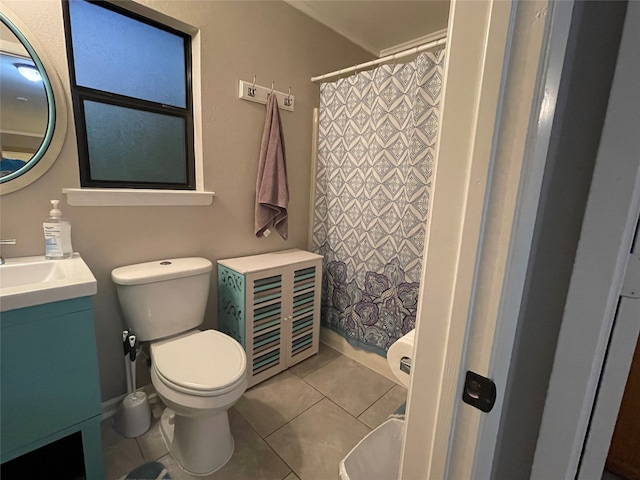 bathroom featuring vanity, tile patterned floors, and toilet