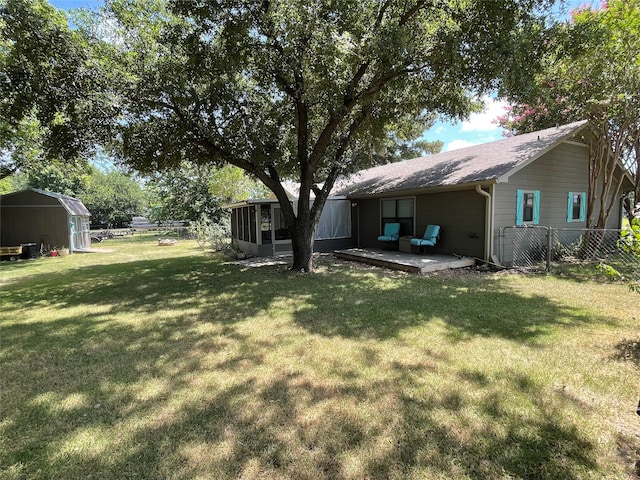 view of yard with a storage shed and a wooden deck