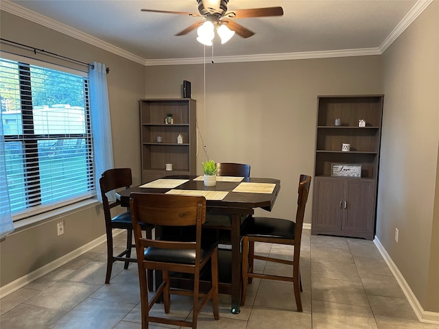 dining space with light tile patterned flooring, crown molding, and ceiling fan