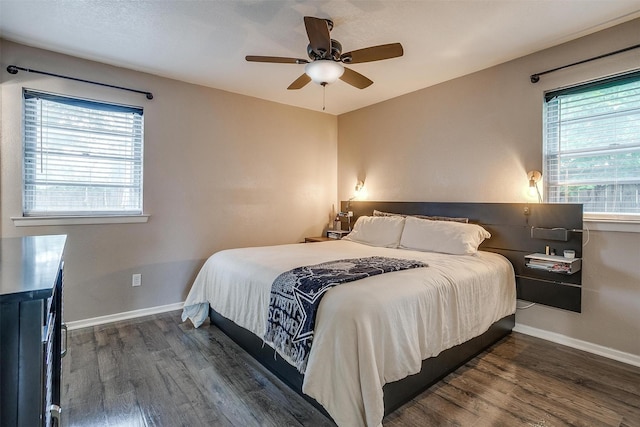 bedroom with dark wood-type flooring and ceiling fan