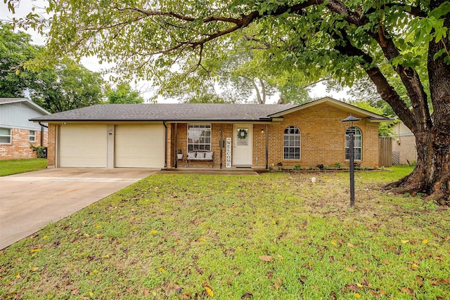 single story home with a garage and a front lawn