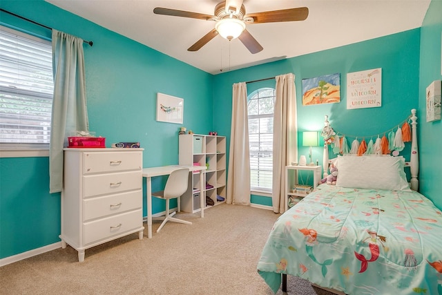 carpeted bedroom featuring ceiling fan