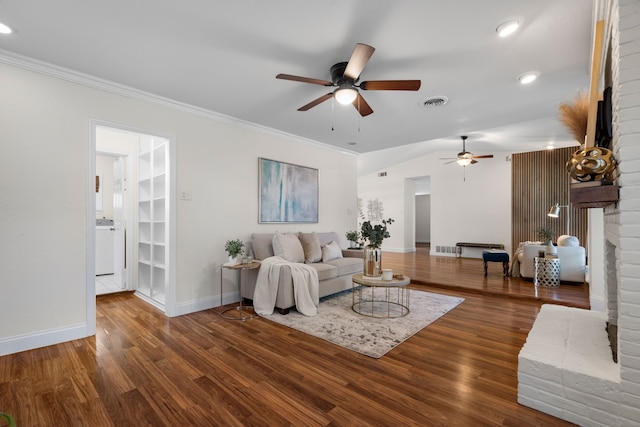 living room featuring a fireplace, ceiling fan, dark hardwood / wood-style floors, and crown molding