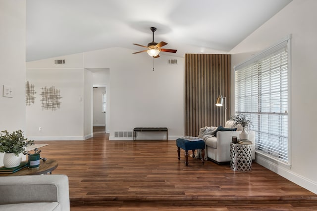 sitting room featuring ceiling fan, dark hardwood / wood-style floors, and vaulted ceiling