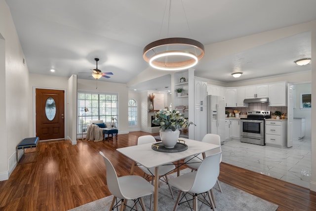 dining space featuring ceiling fan and light hardwood / wood-style floors