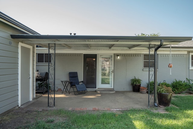 doorway to property with a patio