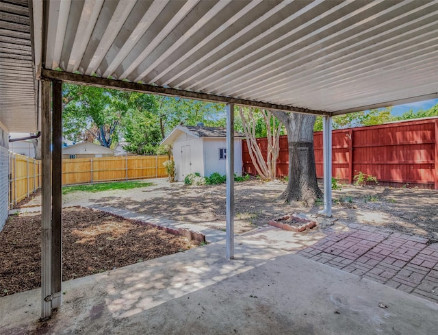 view of patio / terrace featuring a storage unit