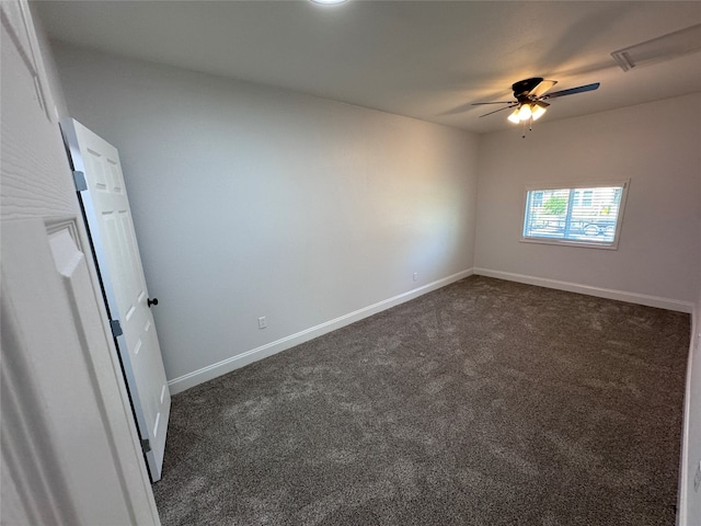 carpeted empty room featuring ceiling fan