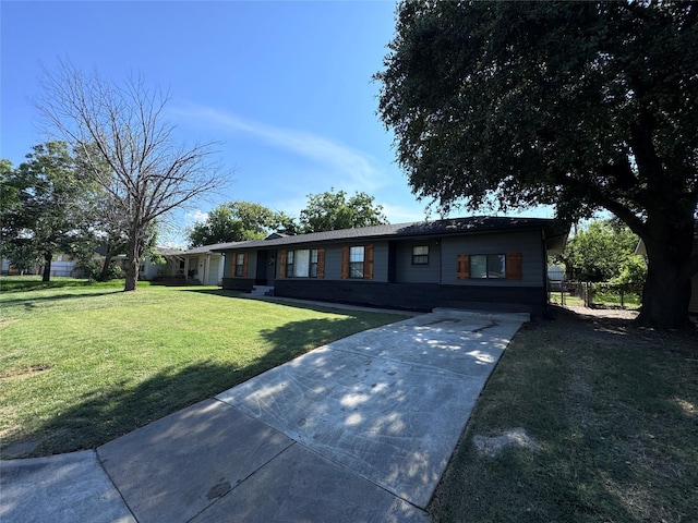 ranch-style home with a front lawn