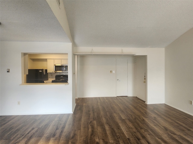 unfurnished living room featuring a textured ceiling and hardwood / wood-style floors