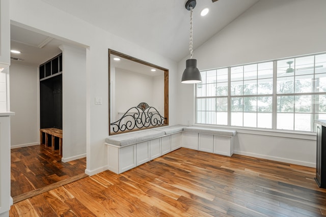 interior space featuring wood-type flooring and high vaulted ceiling