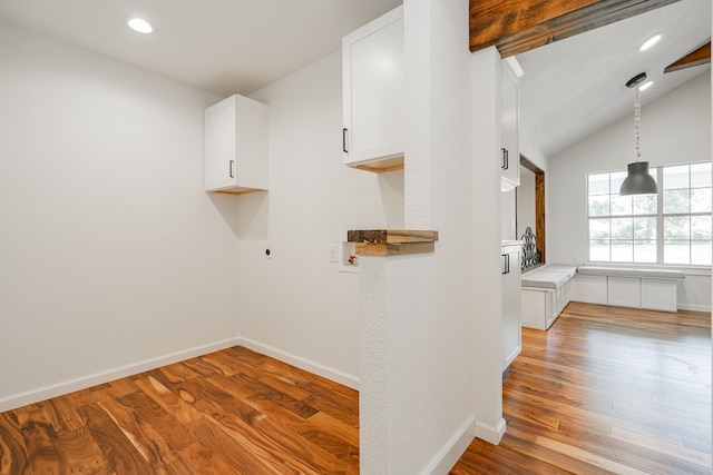 interior space featuring electric dryer hookup, hardwood / wood-style flooring, and hookup for a washing machine