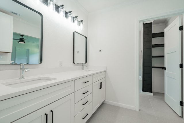 bathroom featuring ornamental molding, tile patterned floors, double sink vanity, and ceiling fan