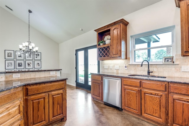 kitchen with vaulted ceiling, dishwasher, sink, tasteful backsplash, and concrete flooring